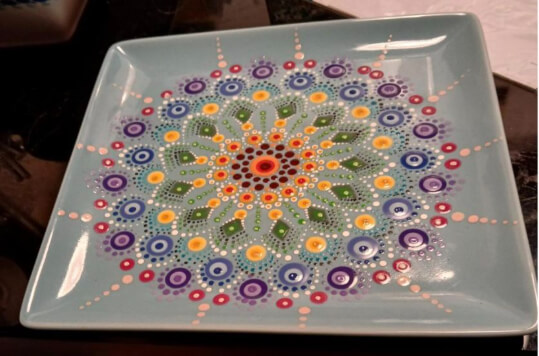Versierd bord Creacafé in Buurtcentrum de Pelikaan